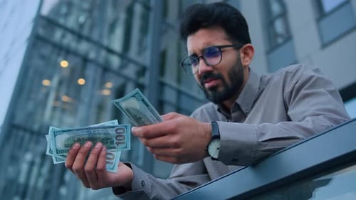 Upset Arabian Indian Man Cash Owner Businessman Hold Hundred Dollars on City Office Terrace Outdoors