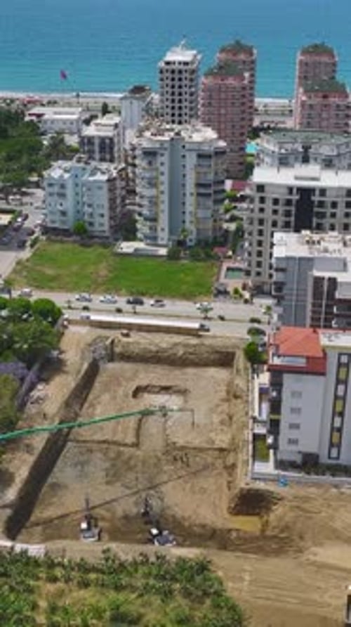 Construction Site Aerial View Near City and Beach