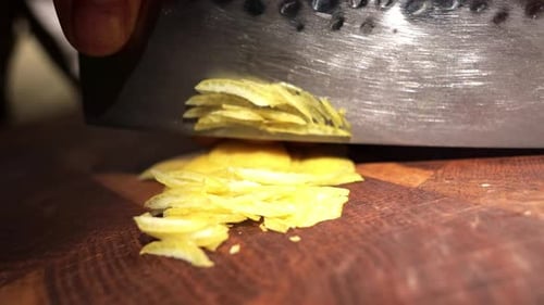 Cutting Lemon Peel on Wooden Cutting Board