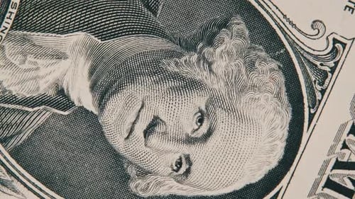 The Portrait of George Washington on the One Dollar Bill Rotates Close Up
