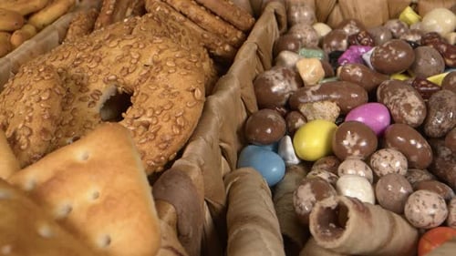 Delicious Candies and Cookies in a Woven Basket