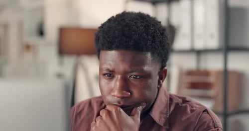 Thinking, black man and reading with laptop in office for research, editor feedback