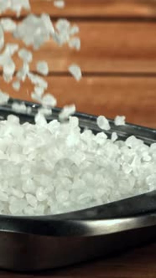 The Salt Falls Into the Container Filmed on a Highspeed Camera at 1000 Fps