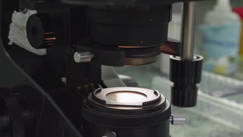 Science Microbiological Studies the Process of Research with a Microscope in a Hospital Laboratory