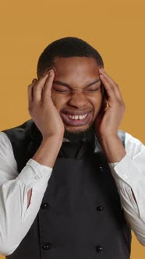 Vertical Video Restaurant Employee Suffering From a Headache and Being Sick