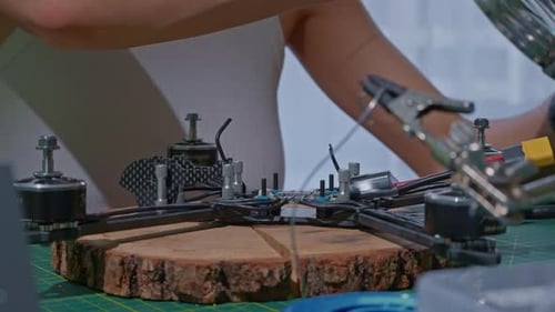 Unrecognizable Person Put Details Into the Quadcopter