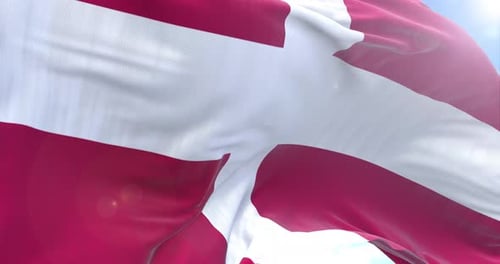Realistic Waving Denmark Flag on Blue Sky Background Loop