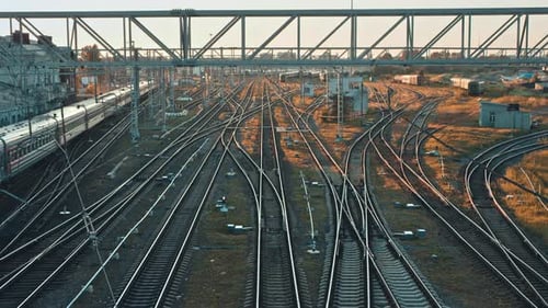 Railway Yard with Train at Sunset or Sunrise