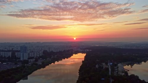 Sunrise on river with beach recreation area