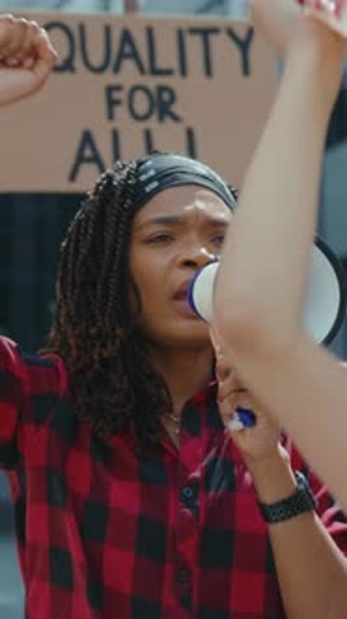 Activist Speaks into Megaphone at Protest