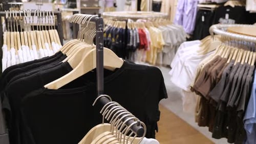 Shopping Mall Boutique Filled with Fashion Tailoring Multiple Racks with Fashionable Formal Wear