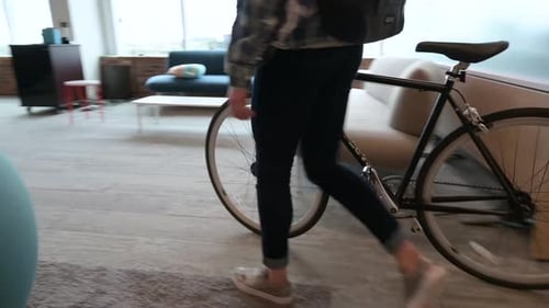 Young Businesswoman Walking Bicycle in Urban Open Plan Office 2024 Years