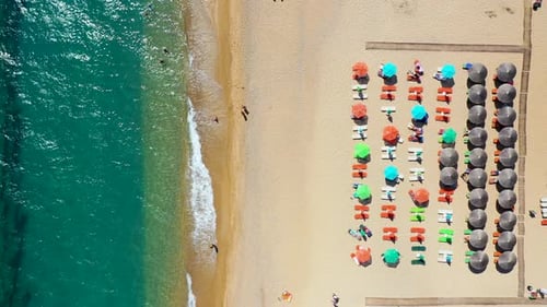 Concept of summer vacation. View from above, stunning aerial view of an amazing beach with beach umb
