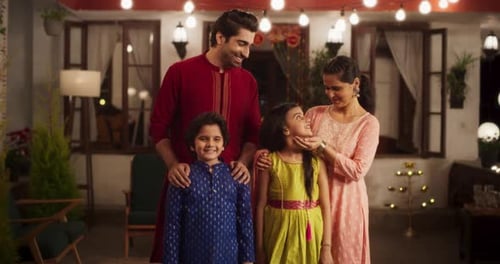 Portrait of Happy Indian Nuclear Family in Traditional Clothes Posing Together. Gorgeous Parents and