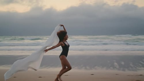 Girl Running Beach Pareo Swaying on Summer Wind