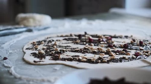 Adding Cranberries to Dough with Chocolate and Nuts