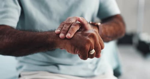 Hands, carpal tunnel and man in home with wrist pain, injury or accident with fibromyalgia