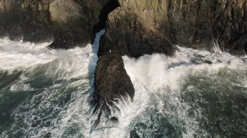 Rough Sea Waves Splashing Rocky Shore Of Pacific Ocean