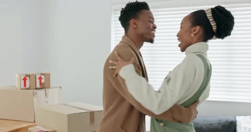 Love, dance and property with couple and box in living room for real estate, moving and mortgage