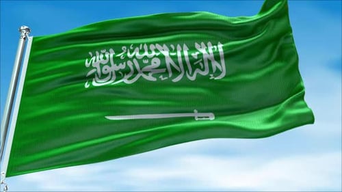 Saudi Arabia Flag Waving in Wind with Blue Sky Background