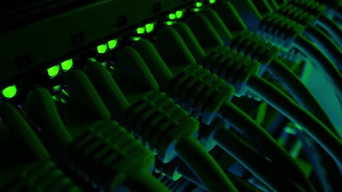 Server Cables Connected with Green Lights in Dark Room