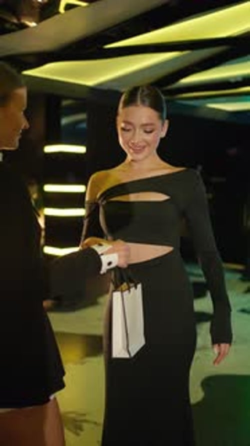 Elegant Woman Receives Package with Gift Luxury Living Concept