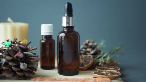 Eucalyptus Essential Oils in a Glass Bottle with Green Leaf on White Background