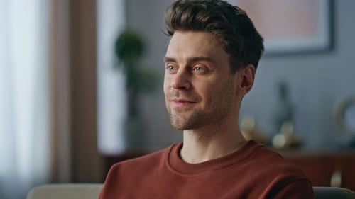 Young Adult Using Laptop Indoors During Daytime