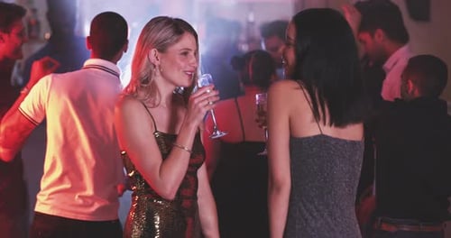 Friends Celebrating with Champagne at Nightclub Party