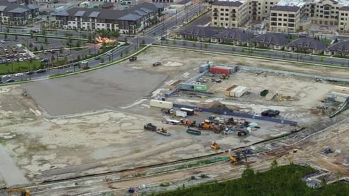 Beginning of Construction Works on Prepared Ground Large Building Site with Scattered Equipment in
