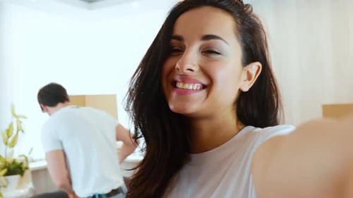 Happy Young Couple Taking Selfie While Moving