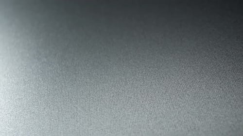 Close-up reveals a detailed view of a metal texture.