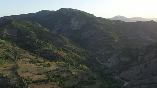 Aerial View Of Green Hills And Mountain Road