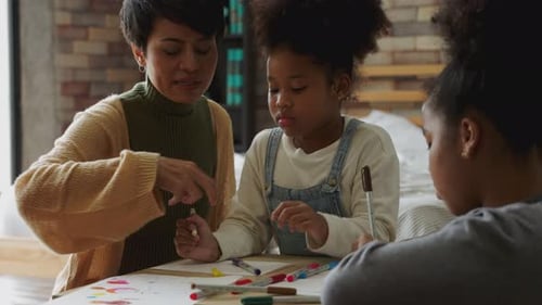 mother daycare talking play teaching helping kid daughter at home
