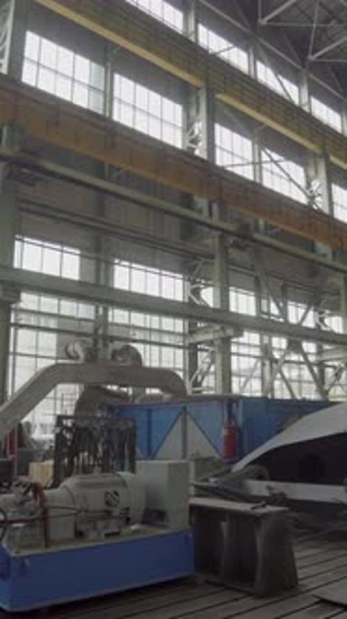 Inside Factory Workers Constructing Large Machine