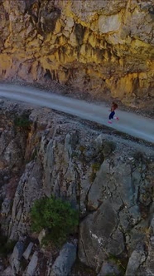 Professional Runner on Mountain Path