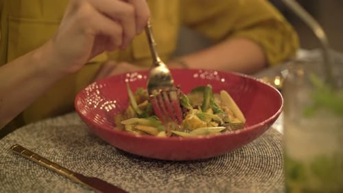 Woman Eating Salad Sitting in Cafe 30s