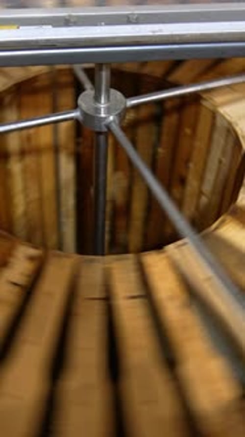 Rotating Machinery Inside Industrial Wooden Cylinder
