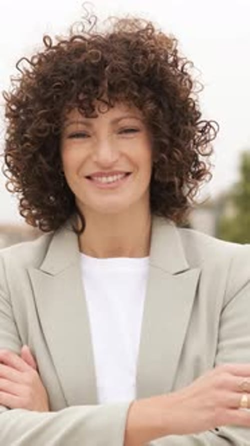 Confident Woman Smiling Portrait with Arms Crossed