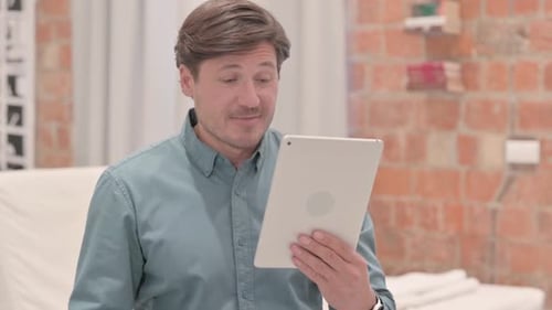 Man Uses Tablet For Video Call