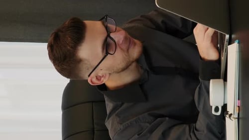 Man Works at Computer in Modern Office