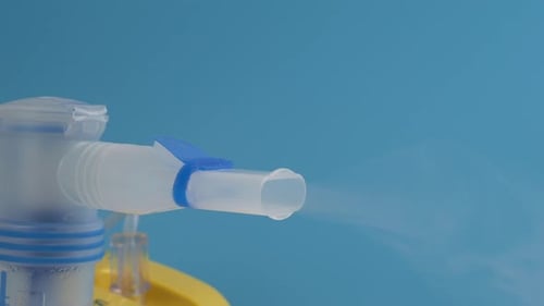 Working portable nebulizer. an inhalation device that uses a fine spray of the drug.