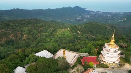 A serene temple nestled in the lush Thai highlands, showcasing traditional architecture with golden