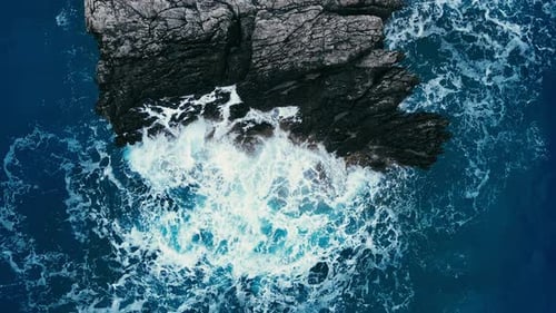 Sea Water Waves Crashing Around Rocky Reef