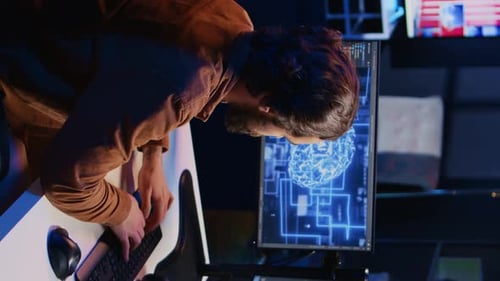 Freelancing Programmer Writes Artificial Intelligence Code on Desktop PC