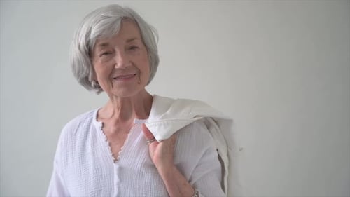 Portrait of a confident senior woman radiating joy and wellbeing in studio