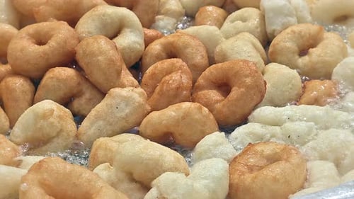 Street Cook Frying Traditional Sweet Lokma in Turkey.