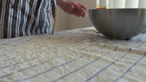 Dough Placed on Flour-Dusted Table for Baking
