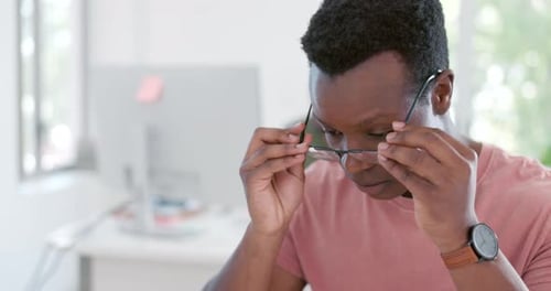 Office reading glasses, black man and working on 404 programming glitch or erp coding error