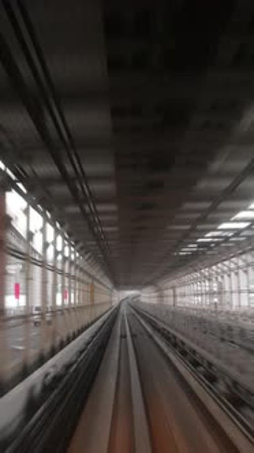 Tokyo Monorail Passing Through the City's Skyscapers in Vertical
